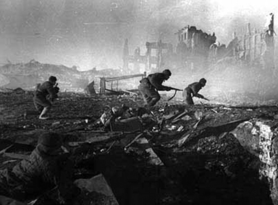 German soldiers use the evening light to approach a Russian outpost on the outskirts of Stalingrad