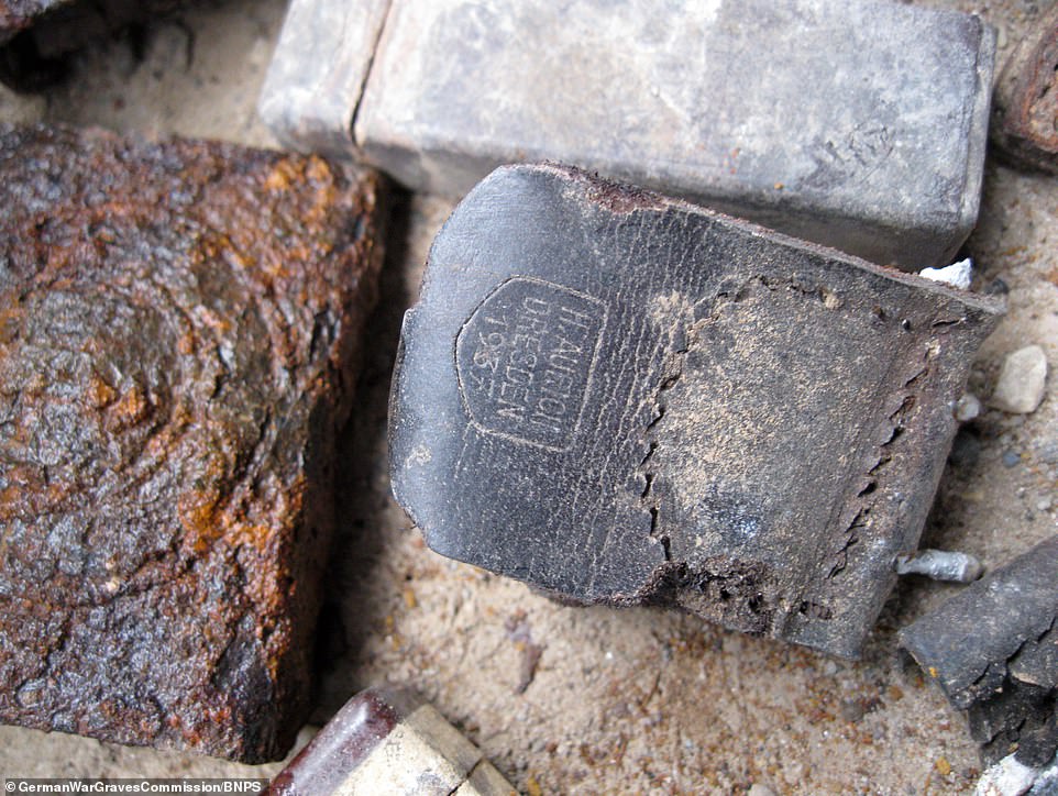 This item bears the name of the dead German soldier who owned it from Dresden, dated 1937. In all, military archaeologists have found a staggering 1,837 bodies - all of them German soldiers